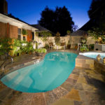 Alaglas Pools' Avanti model fiberglass swimming pool, medium size with spa spillover