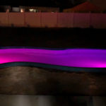 Alaglas Pools Grand Baron, a large freeform fiberglass pool with LED night lighting