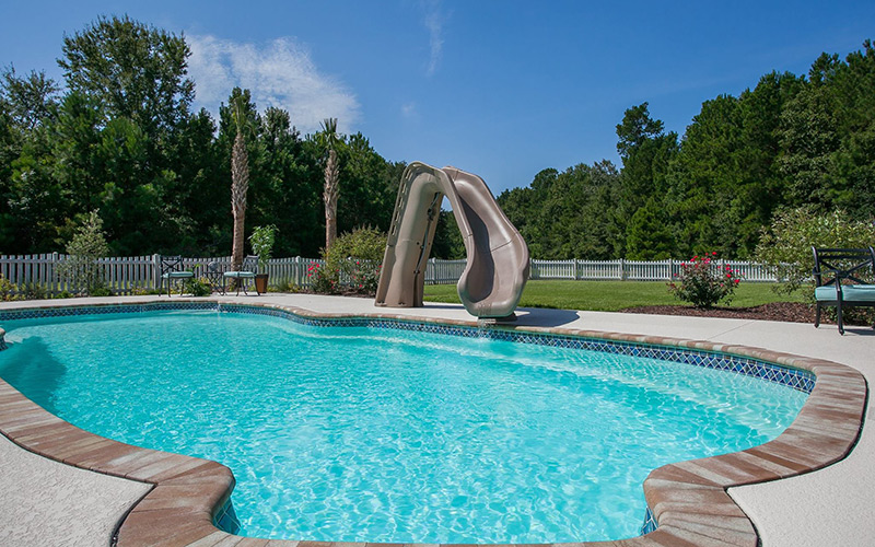 Alaglas Pools' Grand Baron model, a large, freeform shaped pool in white