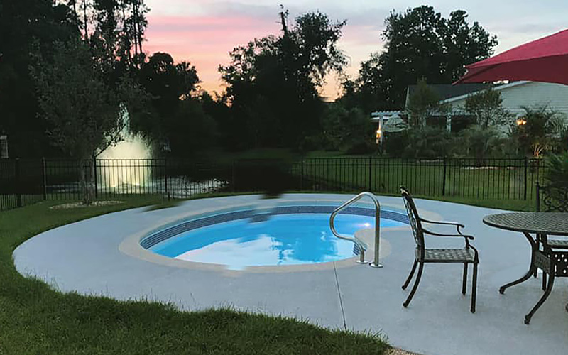 Alaglas Pools' June Bug model, a medium, freeform fiberglass pool in white