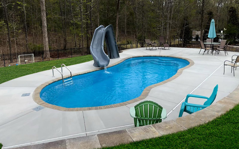 Alaglas Pools' Baron model, a large fiberglass pool in Sapphire blue